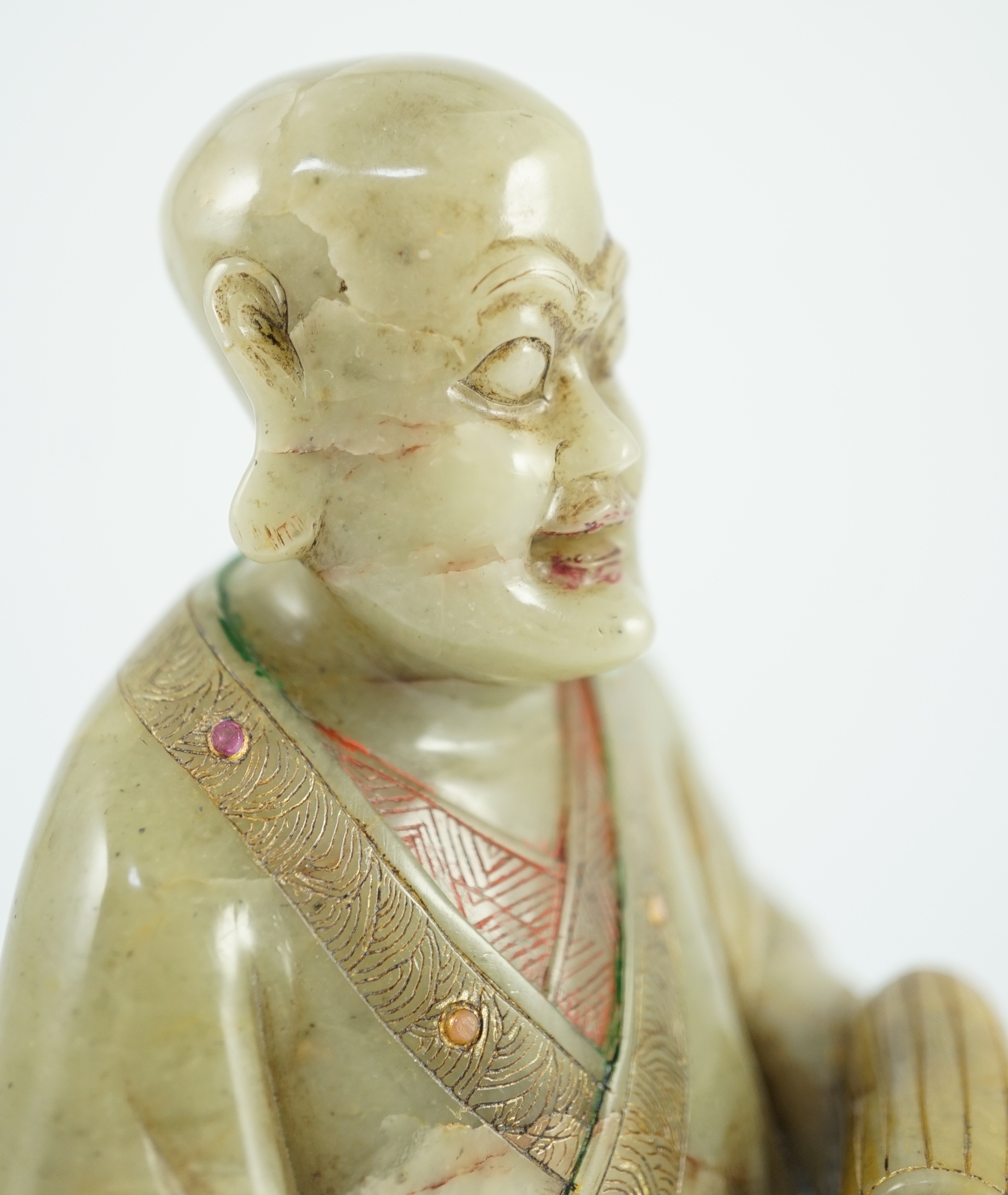 A Chinese soapstone seated figure of a luohan, 18th century, 12.5cm high